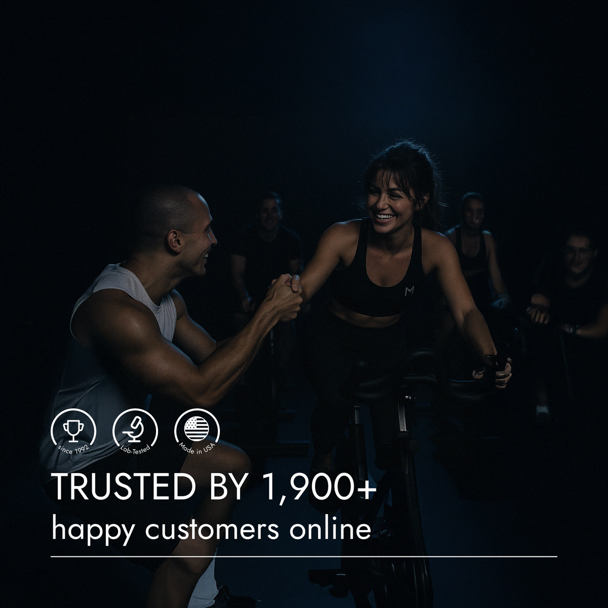 Group of people exercising on stationary bikes in a dark room with text about customer trust.