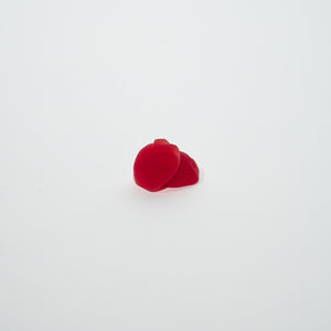Two red gummies on a white background