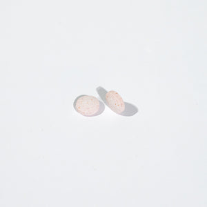 Two round tablets on a white background