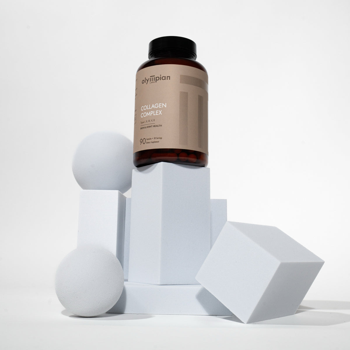 Olimpian Collagen Complex supplement bottle on a white geometric background