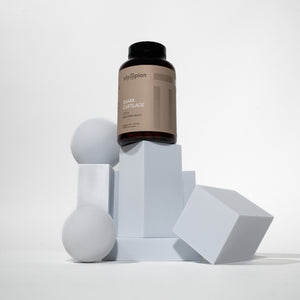 Supplement bottle on geometric shapes with a white background