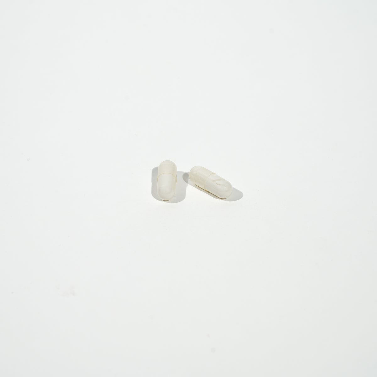 White pill on a white background