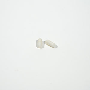 White pill on a white background