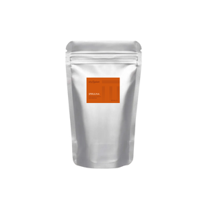 Silver foil packaging with an orange label on a white background
