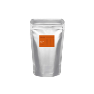 Silver foil packaging with an orange label on a white background